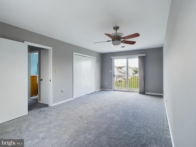 empty room featuring carpet and ceiling fan