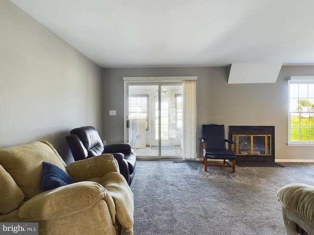 carpeted living room featuring plenty of natural light