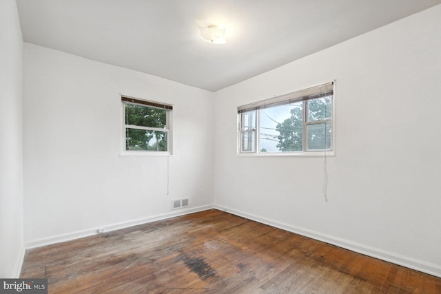 unfurnished room featuring wood-type flooring