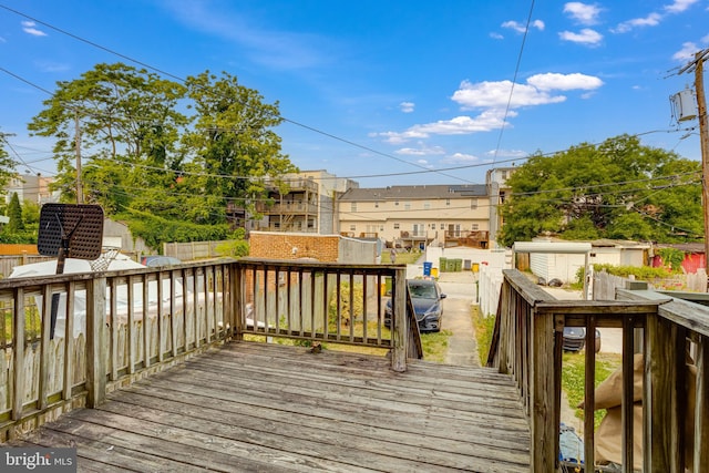 wooden deck featuring a shed