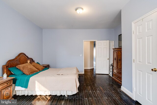 bedroom with wood-type flooring