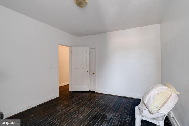 unfurnished room with hardwood / wood-style floors