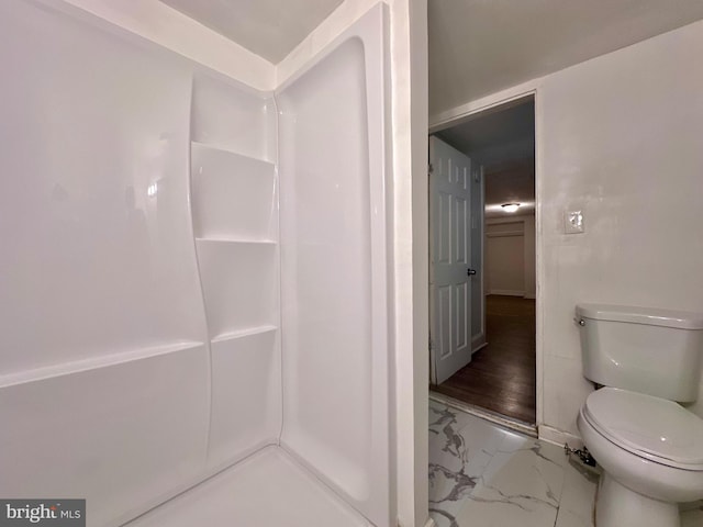 bathroom featuring hardwood / wood-style floors and toilet