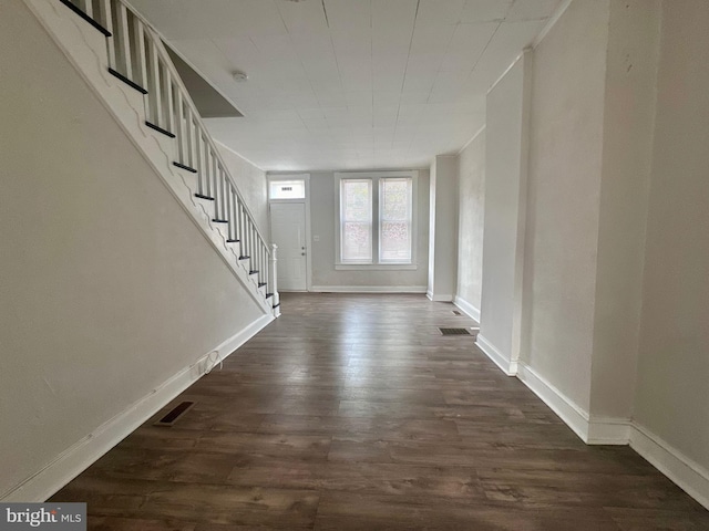 entrance foyer with dark hardwood / wood-style floors