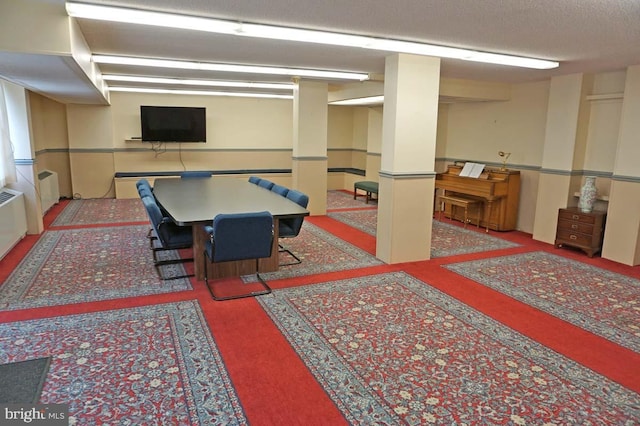 playroom featuring a textured ceiling