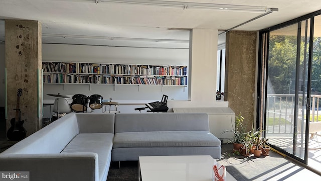 sitting room with a wall of windows