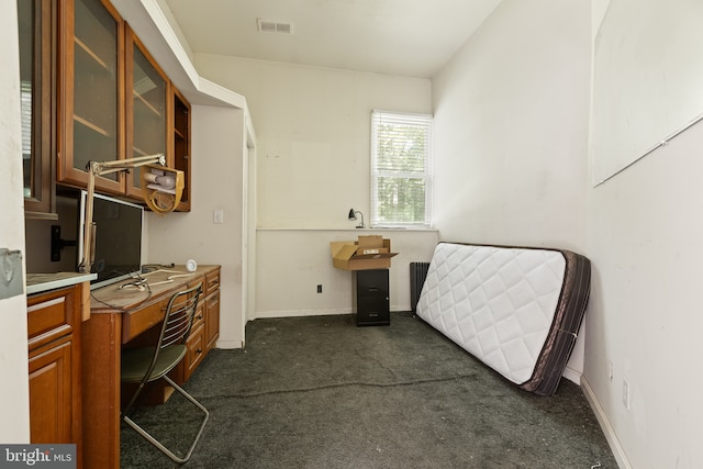 office area featuring dark colored carpet