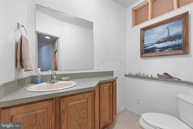 bathroom with vanity, tile patterned floors, and toilet