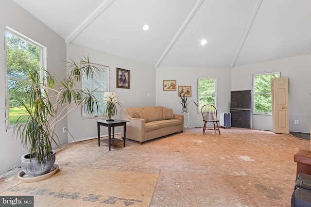 living room featuring high vaulted ceiling and beamed ceiling