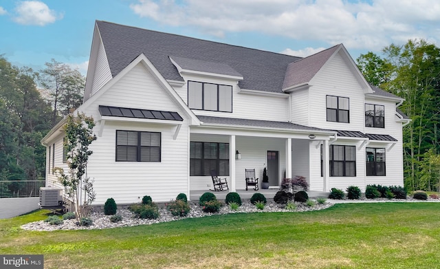 modern farmhouse featuring a front lawn and central AC