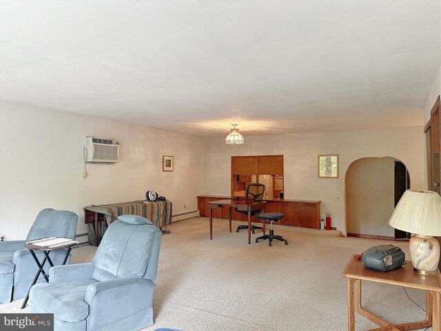 living room featuring a baseboard radiator, light carpet, a wall unit AC, and a chandelier