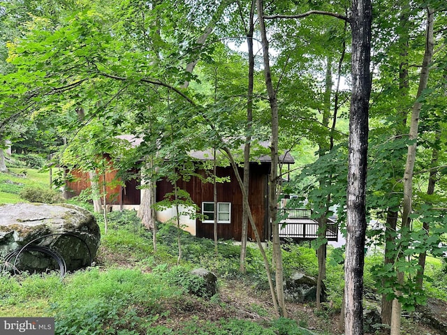 view of property exterior featuring a deck