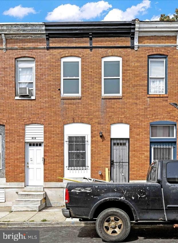 view of property with brick siding