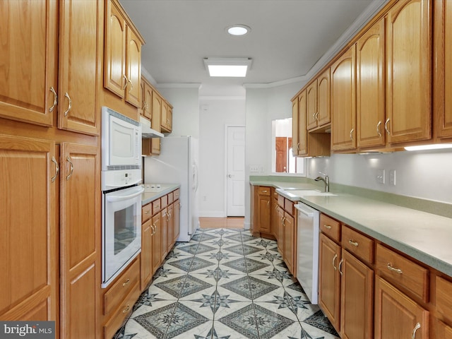 kitchen with sink, white appliances, and ornamental molding