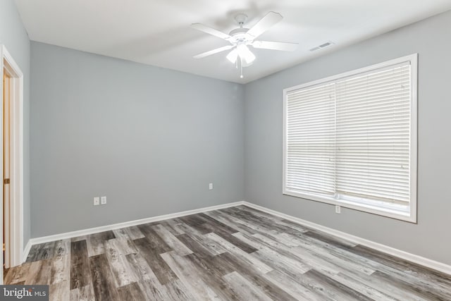 unfurnished room featuring hardwood / wood-style floors and ceiling fan