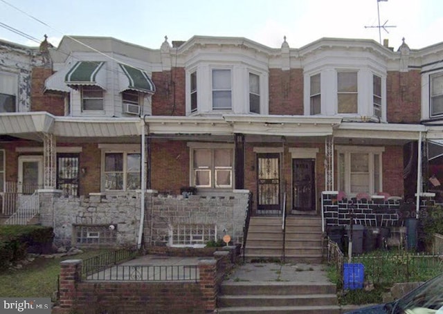 view of property featuring brick siding