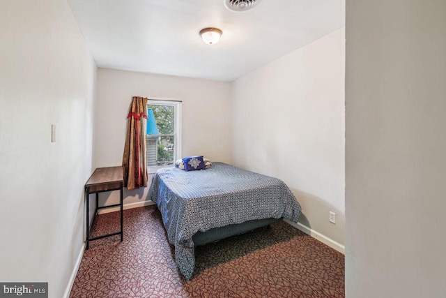 bedroom featuring carpet, visible vents, and baseboards