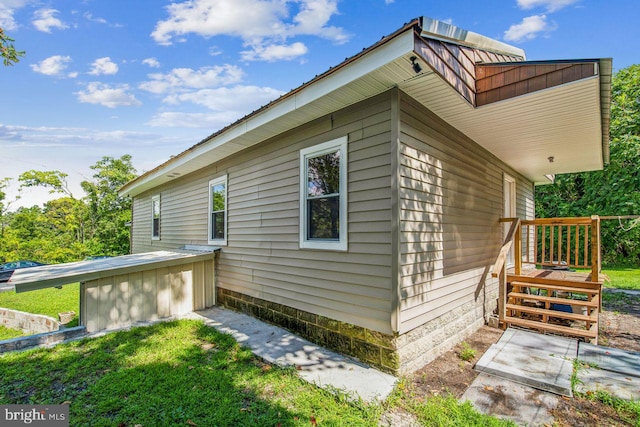 view of property exterior with a yard