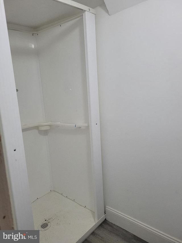 bathroom featuring baseboards and wood finished floors