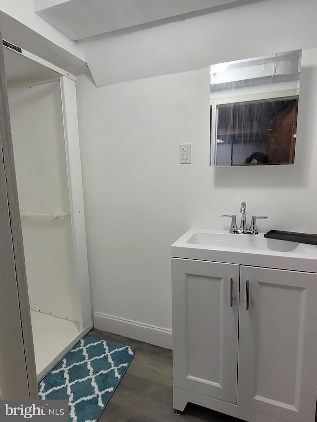 bathroom featuring vanity and wood-type flooring