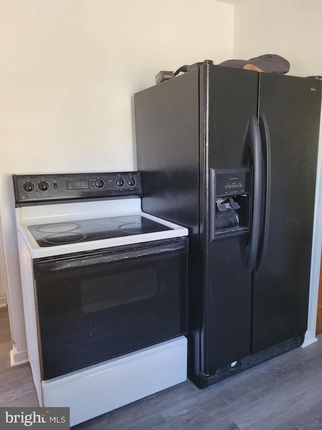 kitchen with black fridge with ice dispenser, dark hardwood / wood-style flooring, and white electric stove