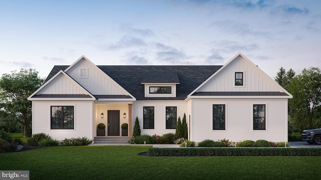 modern farmhouse style home with a front lawn