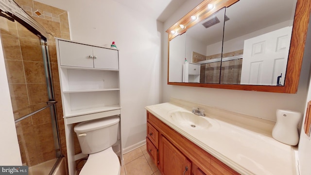 bathroom with toilet, tile patterned flooring, visible vents, and vanity