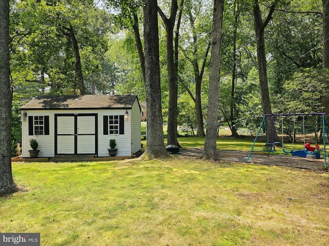 view of yard with a playground and a shed