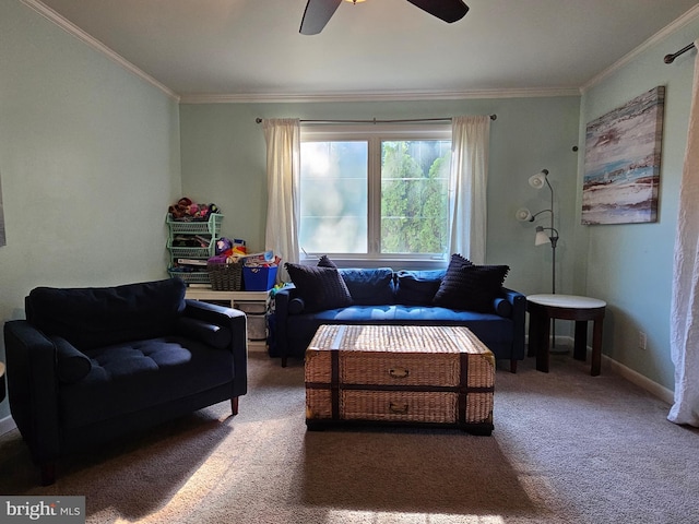 carpeted living room with ceiling fan and crown molding