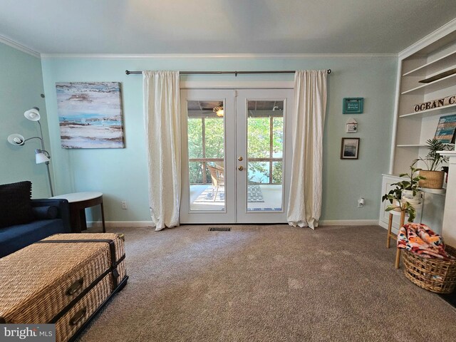 living area featuring carpet floors, crown molding, and french doors