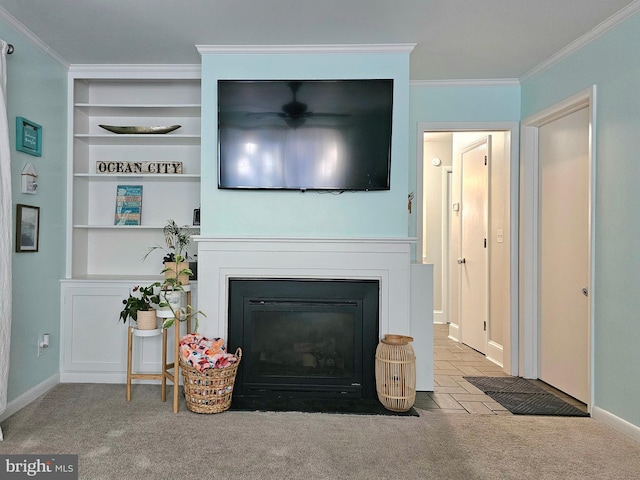 living room featuring built in features, crown molding, and light carpet