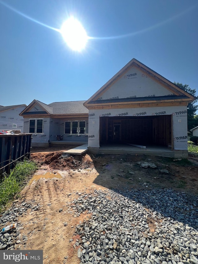 unfinished property featuring a garage