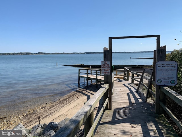 view of dock with a water view