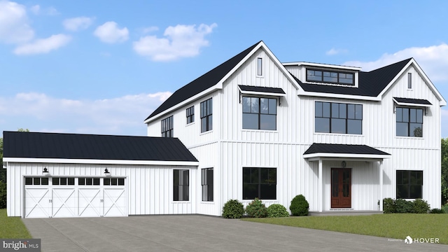 modern inspired farmhouse with a garage