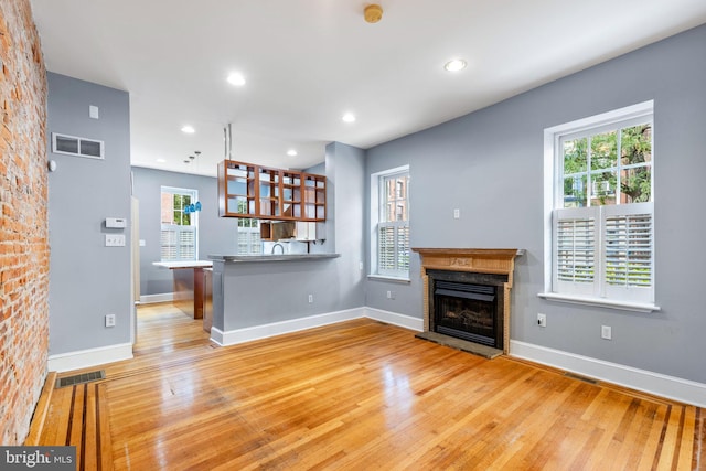 unfurnished living room with wood-type flooring