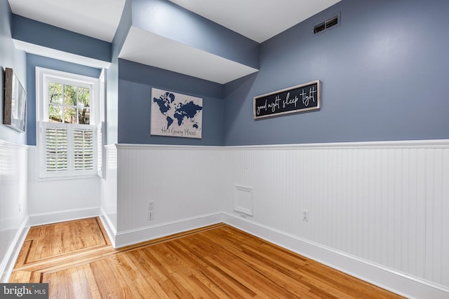 empty room featuring wood-type flooring