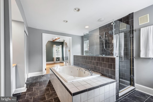 bathroom featuring independent shower and bath and tile patterned floors