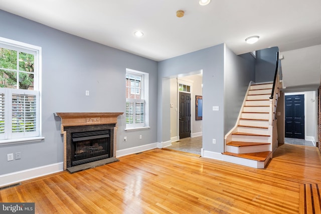 unfurnished living room with light wood-type flooring