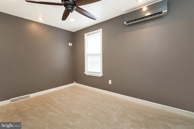 carpeted empty room with ceiling fan and a wall mounted air conditioner