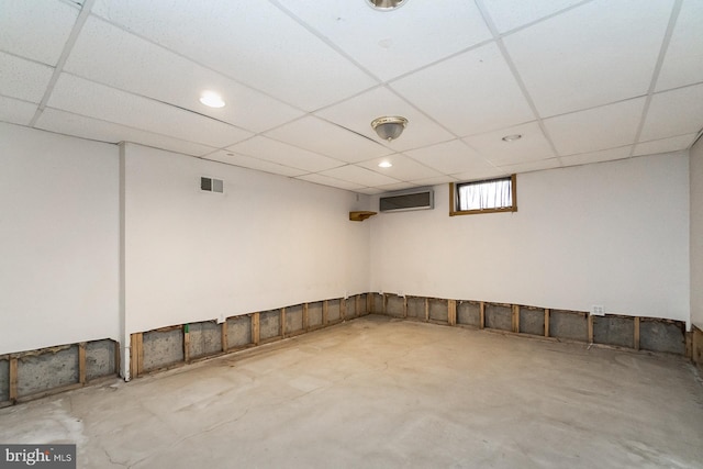 basement with a paneled ceiling