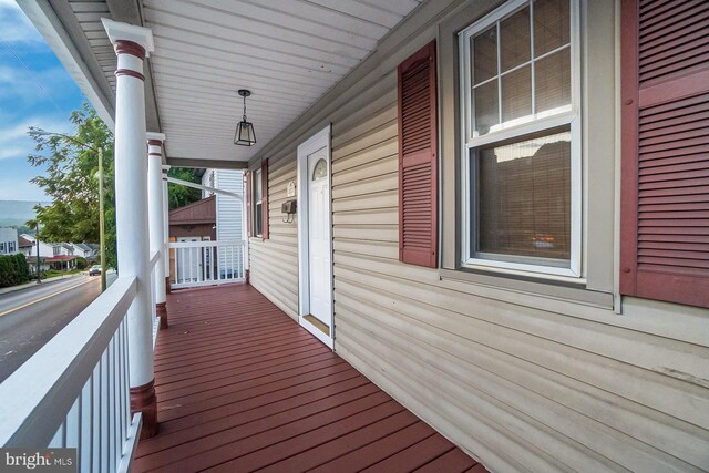 wooden deck featuring covered porch