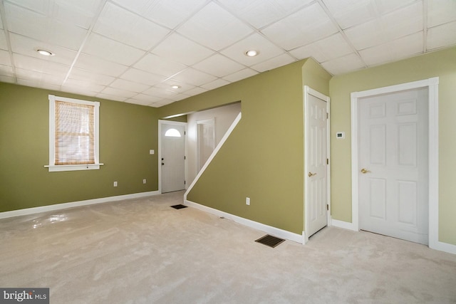 interior space featuring a drop ceiling