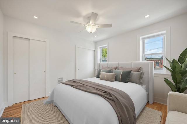 bedroom featuring ceiling fan and light hardwood / wood-style floors