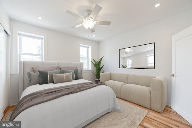 bedroom featuring ceiling fan and light hardwood / wood-style floors