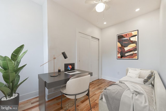 office with ceiling fan and light wood-type flooring