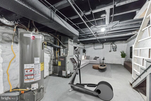 interior space with water heater and concrete flooring