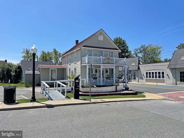 view of front of property with a balcony