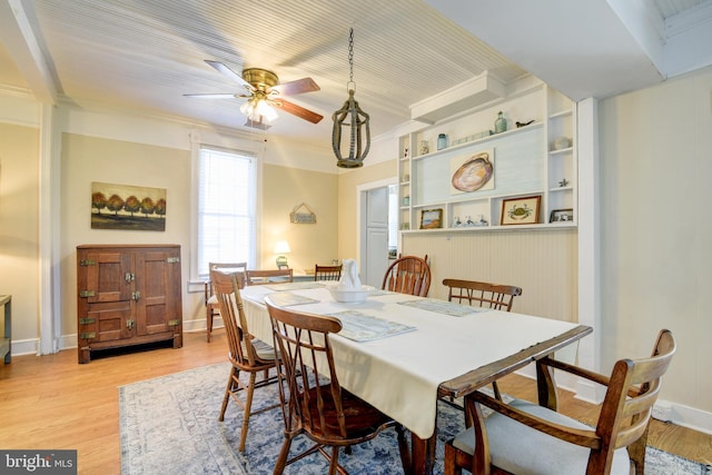 dining room featuring ceiling fan, light hardwood / wood-style floors, and ornamental molding