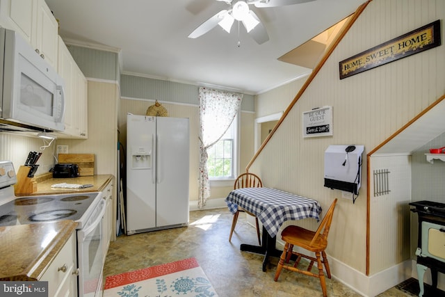 kitchen featuring white appliances, ceiling fan, white cabinets, and light tile patterned floors