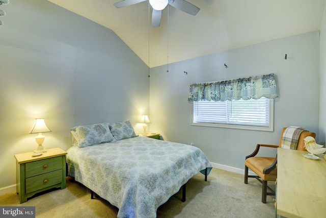 carpeted bedroom featuring ceiling fan and vaulted ceiling